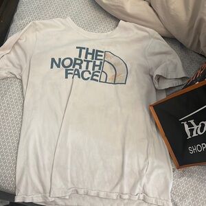 Basic North face T a little stain probably would be an easy fix